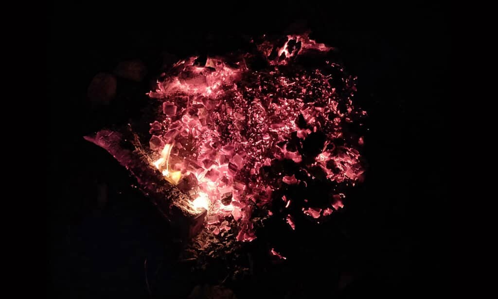 Embers in a fire pit circled