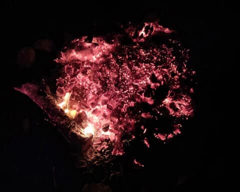 Embers in a fire pit circled