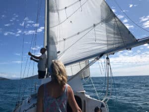 Two people sailing a 28 foot boat